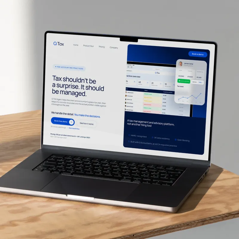 Q TAX website on a laptop screen: the first screen “Tax shouldn’t be a surprise. It should be managed”