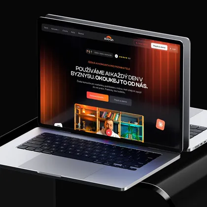 Multi-page website of the AI Kruh community on a laptop