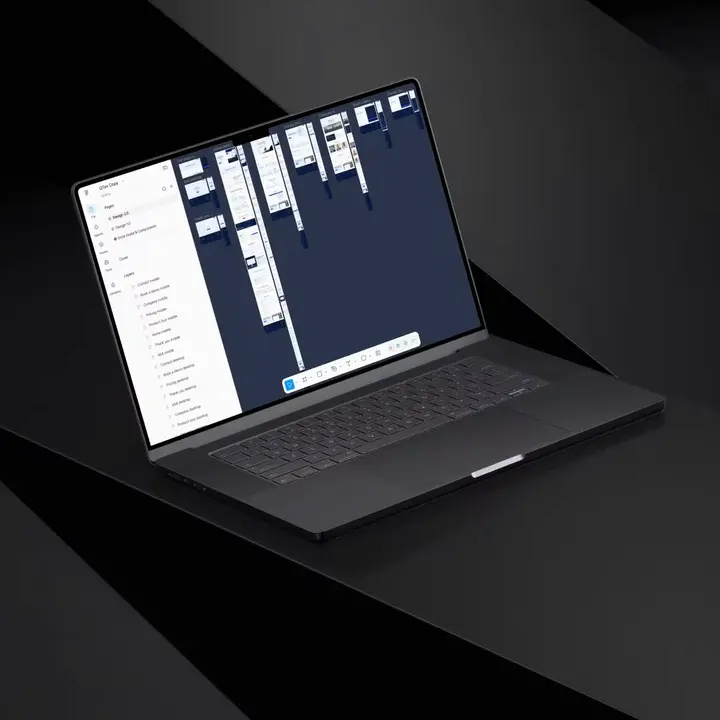 Website design mockups in Figma on a laptop screen